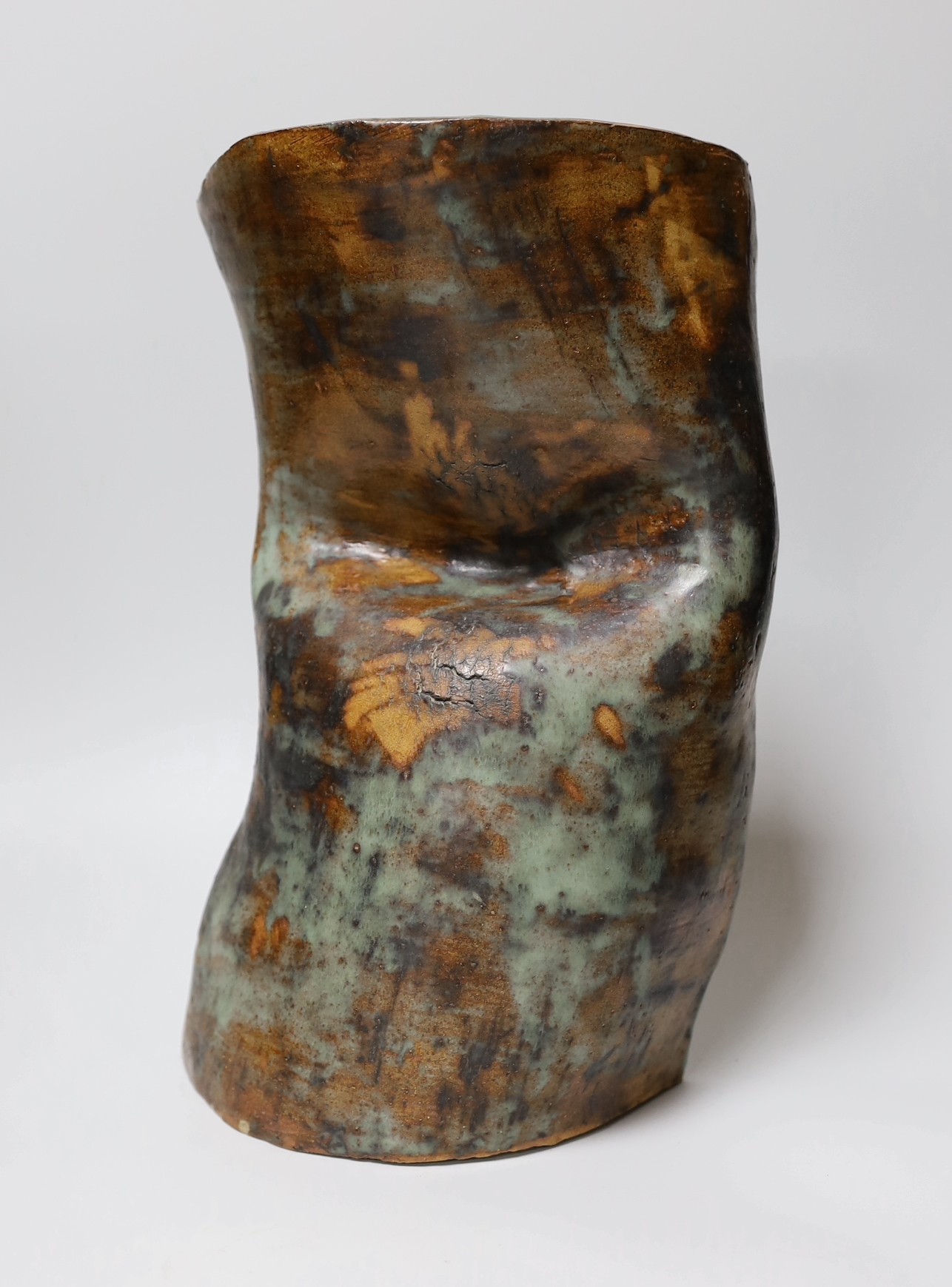 Ruth Sulke - a studio stoneware green and brown glazed free-form vase, 37cm